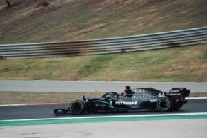 black and white f 1 car on road during daytime